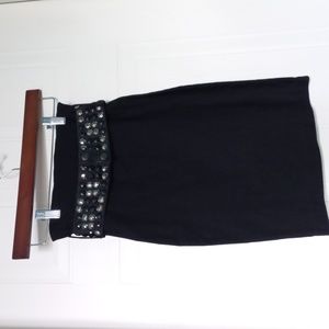 Black pencil skirt with geometric belt